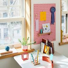 Holes in each pegboard are uniformly spaced in columns and rows. Pegboard Pegs Set Pink Desk Accessories Organizers