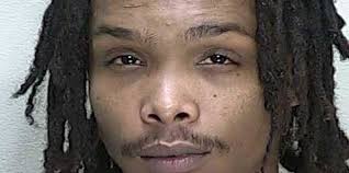 Employee arrested in connection to gun stolen from hotel