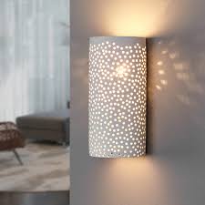 Like a translucent sheath delicately draped around the most graceful form, conico offers a delicate opal white panel of. Perforated Wall Light Jiru Made Of White Plaster Lights Co Uk