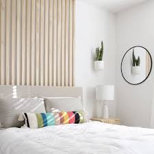 Throw A Few Sticks On The Wall And Bam The Room Is Still In Progress There S No Feature Wall Bedroom Wall Behind Bed Colorful Bedroom Inspiration