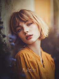 In the pale hush of a suspended moment, she gathers the traces of a dream  left behind. A shiver of light moves through her, awakening a courage she  had never dared to