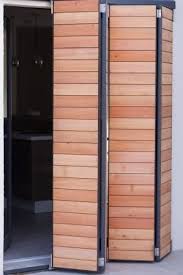 Les Volets Un Veritable Allie Pour La Maison Passive Ils Permettent De Proteger La Maison Du Froid De La Nuit Et D Door Design Wooden Shutters House Exterior