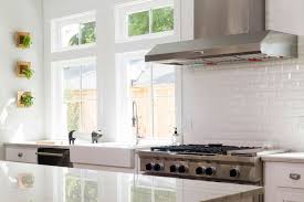 A Classic Yet Modern Kitchen Featuring Beveled White Subway Tile Backsplash Modern Kitchen Subway Tile Patterned Kitchen Tiles White Modern Kitchen