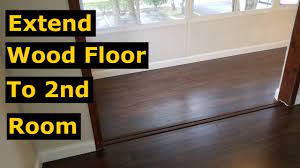An irregular transition of natural wood flooring and kitchen floor tiles (peter a. How To Extend Laminate Wood Flooring To Another Room Diy Tips Youtube