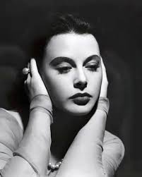 A stunning Kodachrome color photo of Norma Shearer in gold lamé, 1940 I  don't know the designer but…..