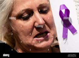Deborah Howland who lost her daughter to a drug overdose protesters along  with others in support of a proposed supervised injection site, outside the  federal courthouse in Philadelphia, Thursday, Sept. 5, 2019.