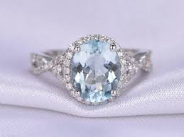 Is the aquamarine framed by tiny diamonds? Aquamarine Ring Infinity Engagement Ring Bbbgem