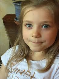 Lilly Lewis with a pensive smile. 6/16.6yr old