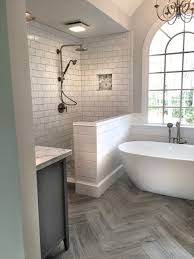 With a classic wood toilet lid, simply vanity base, stone tile floors, and a framed cow print, this bathroom has all the farmhouse staples. 75 Beautiful Farmhouse Ceramic Tile Bathroom Pictures Ideas August 2021 Houzz