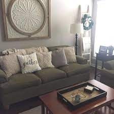 Unsure How To Fill The Wall Space Above Your Couch Decorate In One Fell Swoop By Hanging A Large Piece Of Wall Decor Living Room Couch Decor Living Room Wall