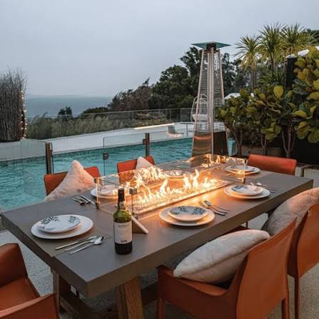 Gas dining fire table as centerpiece for outdoor patio dining set