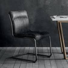 Dining chairs don't just need to look good, they need to be comfortable enough so you will want to linger around the table well past dessert. Cult Living Metal Chairs