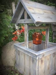 Attach the galvanized bucket to the top of the twig handle. Pieceful Patches Rustic Wishing Well Rustic Wishing Well Diy Wishing Wells Garden Wishing Well Ideas