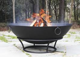 The fire pit bowl is made from durable cast iron and is aged using an oxidation process for a rustic look. Fire Pit Metal Cauldron Fire Pit