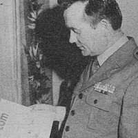 Newly promoted Brigadier General Joe G. Taylor Jr. is congratulated by Fred  Lathem, Mayor of Killeen, Texas, at a reception held at the 4th Infantry  Division Headquarters Foyer following his promotion ceremony -