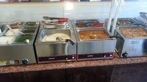 We were meaning to take pictures but it smelled so good we dug right in. Toppings Rice And Some Sides Picture Of Everest Curry Kitchen Sandy Tripadvisor