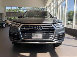 Front Close View Of The 2018 Audi Q5 With Grill And Headlights In Monsoon Grey Metallic Vehicle Available At Audi Of Bri Audi Dealership Audi Used Luxury Cars