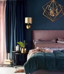 I Am Loving This Navy Blue Pink Color Scheme The Gold Geometric Light Fixtures Complement The Room Ver Luxurious Bedrooms Elegant Bedroom Home Decor Bedroom