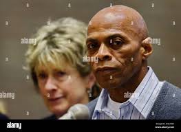 Edward Lee Elmore, right, is accompanied by his lead counsel Diana Holt,  left, during his hearing