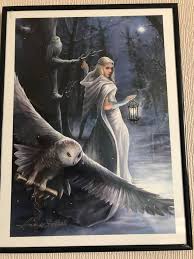 I thought we'd have another owl picture today, so here as the featured art  is "Midnight Messenger". The white witch walks through the winter forest at  night as snow flakes fall around