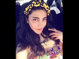 Try a touch of waves to frame the front of your forehead, and use a center parting to balance both sides of your face. Shruti Haasan S Hippie Hairstyle Shruti Haasan In Italy Filmibeat