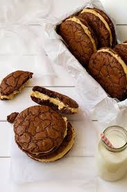 Brownie Cookie Sandwich With Peanut Butter Frosting Recipe Desserts Recipetin Eats Eat Dessert