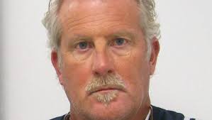 Police: Ex-coach solicited a minor