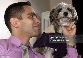 Dec.21,2001-Harold Ortiz with his Jackpooh Lola in her new Christmas...  News Photo