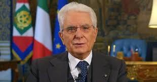 Mattarella si passa la mano tra i capelli, lo guarda. Italy Living Through Sad Page In Our History Says President