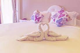 To fold a towel swan, follow these directions. Instructions For Folded Towel Animals Lovetoknow