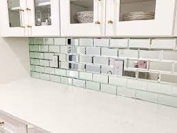 Go with a mosaic tile design. How To Install A Mirrored Tile Backsplash Shabbychichouse Com