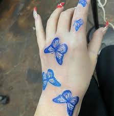 Blue Butterfly Tattoo On Hand In 2020 Butterfly Hand Tattoo Butterfly Tattoos On Arm Blue Butterfly Tattoo