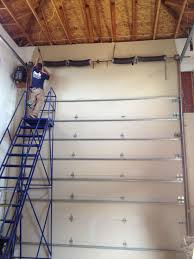 Replacing Broken Garage Door Springs On A 14 Tall Garage Door Chamberlain Commercial Broken Garage Door Spring Residential Garage Doors Garage Door Springs