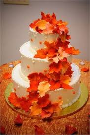 A Lovely 3 Tier Wedding Cake With Burnt Orange Leaves Cascading Down The Side This Cake Is Simply Perfect For Orange Wedding Cake Fall Wedding Cakes