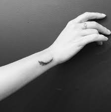 Get Ideas From This 35 Wonderful Wrist Tattoos For Women White Feather Tattoos Tiny Wrist Tattoos Wrist Tattoos For Women