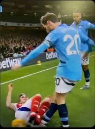This is one action that referee failed to caution Bernardo. VAR refused to  review it. This is a violent conduct against Trossard. If Arsenal player  did this against another player, the whole