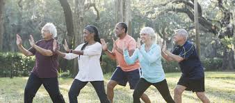 Multi-ethnic group of seniors taking tai chi class | NCOA