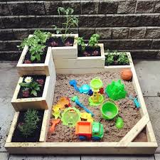 A Diy Sandbox Garden That Is Perfect For Kids To Play In And Learn About Gardening We Planted Flowers Play Area Backyard Kids Outdoor Play Gardening For Kids