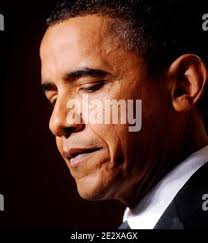 US President Barack Obama looks at the "flood-proof" bridge design project  from Avery Dodson, Natalie Hurley, Miriam Schaffer, Claire Winton and Lucy  Claire Sharp from Tusla. OK, winners of the Junior FIRST