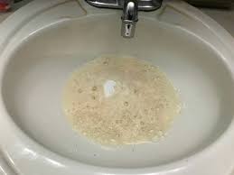 clearing a clogged bathroom sink
