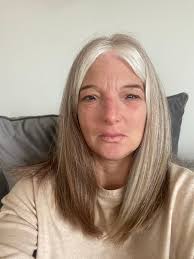 So the first picture is my hair now I have natural auburn brown hair at the  back and the white bits I've had for a long time. But now it's all going