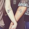 Anchor with heart tattoo on couple finger. 3