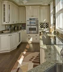 Everything you need to know. 35 Striking White Kitchens With Dark Wood Floors Pictures White Kitchen Interior Design Antique White Kitchen Green Granite Countertops