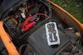 Where is the battery located on a riding lawn mower? How To Charge A Lawn Mower Battery The Right Way