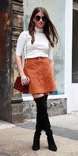 The camel color will clash with the black tights and boots unless you wear a top that has black in it. Camel Mini Skirts Howtowear Fashion