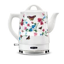 Electric kettle and coffee cup set in hotel room, ceramic cup set small white electric kettle, teapot, sugar bowl and empty cup with ceramic tea spoon on saucer on a white background. Bella 1 5l Ceramic Electric Kettle Butterfly Pattern 14747 From Sensio Accuweather Shop