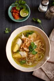 Add some of the shredded chicken and eggs, top with crisps potatoes and garnish with poyah and. Cooking Tackle Soto Ayam Classic Indonesian Aromatic Chicken Soup Indonesian Food Soto Ayam Recipe Asian Recipes
