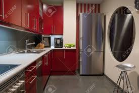 A monochromatic color scheme is very modern for any space, and the kitchen is no exception. Modern Kitchen In Red And Grey Colors Stock Photo Picture And Royalty Free Image Image 4182451