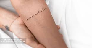 These symbolize the practitioner's impure body, speech, and mind; Om Mani Padme Hum Lettering Tattoo On Inner Forearm