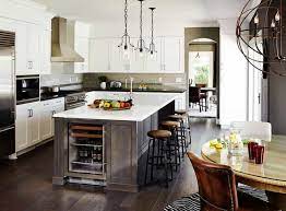 A chandelier is installed in the middle with drop lights over the dining counter. 44 L Shape Kitchen Layout Ideas Photos Home Stratosphere